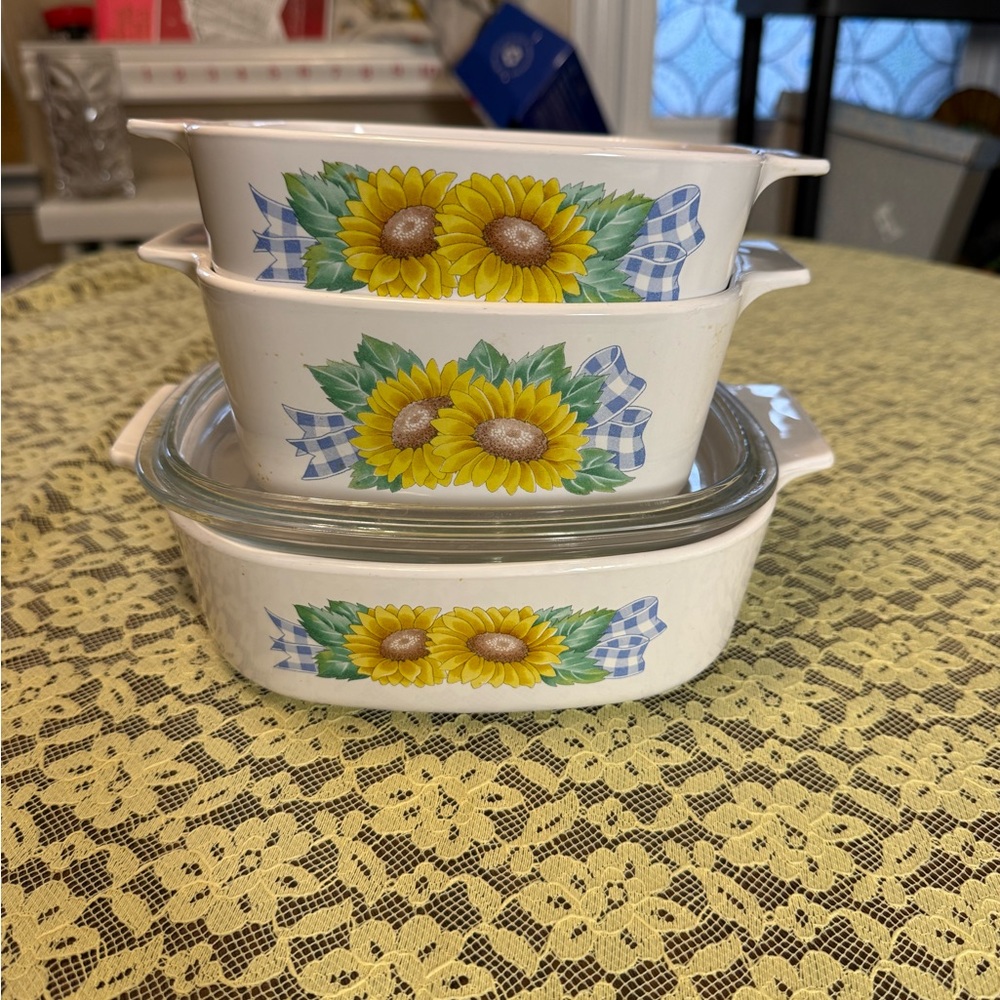 Vintage CorningWare casserole dishes in the Sunsations pattern.